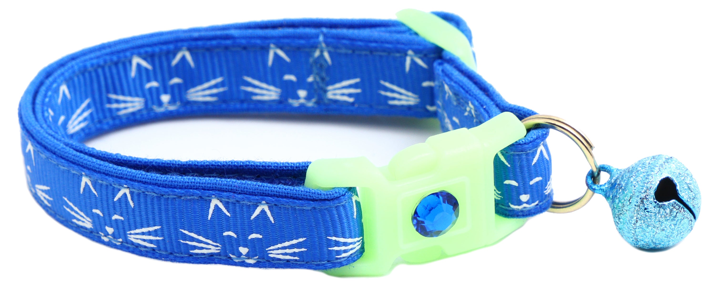A glowing cat faces breakaway collar made of reinforced cotton, featuring a bell and charm, perfect for nighttime visibility.